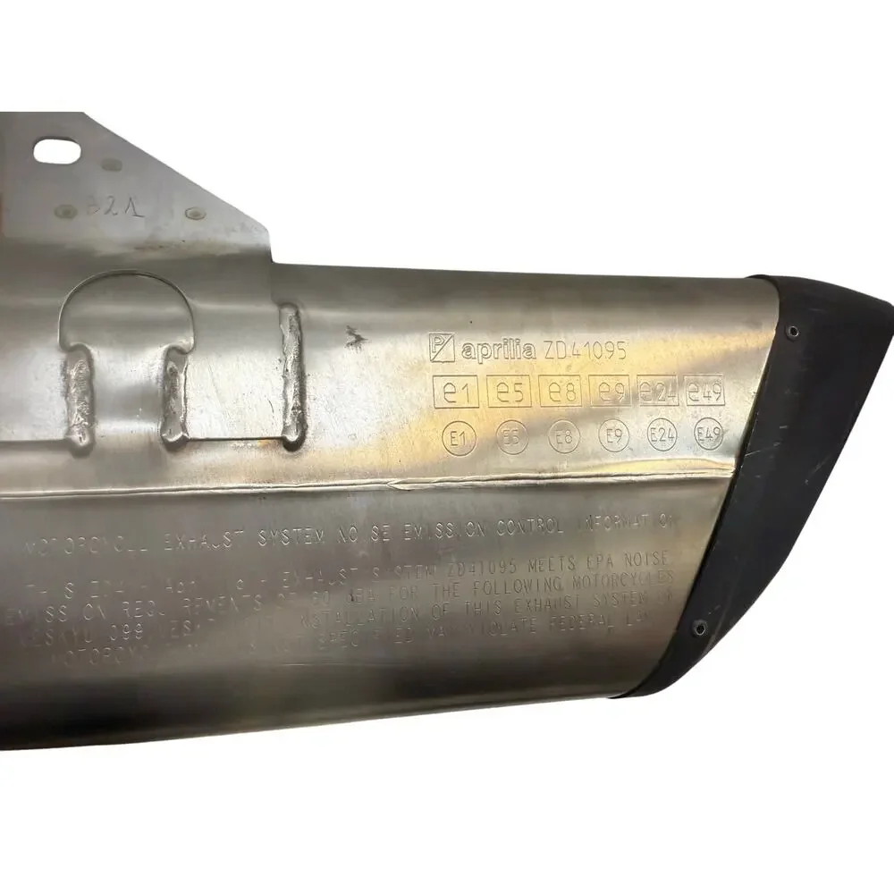 . motorcycle exhaust system, specifically an SC-Project exhaust for an Aprilia